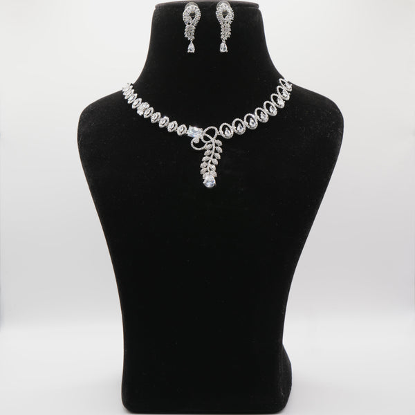 Jewelry set including a necklace and earrings on a black mannequin bust against a white background.