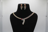 Ruby Red Jewelry set with necklace and earrings on a black mannequin bust against a white background