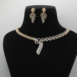 Jewelry set close up with necklace and earrings on a black mannequin bust against a gray background
