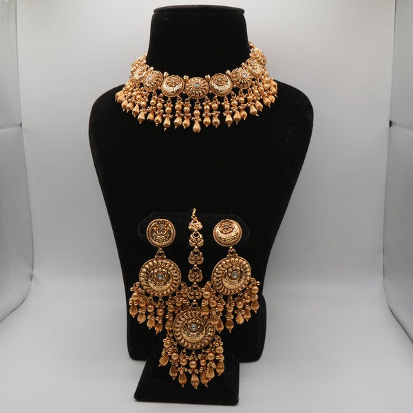 Aditi Temple Bead Choker Set — gold plated temple medallion choker necklace with golden bead drops, matching round chandelier earrings and maang tikka