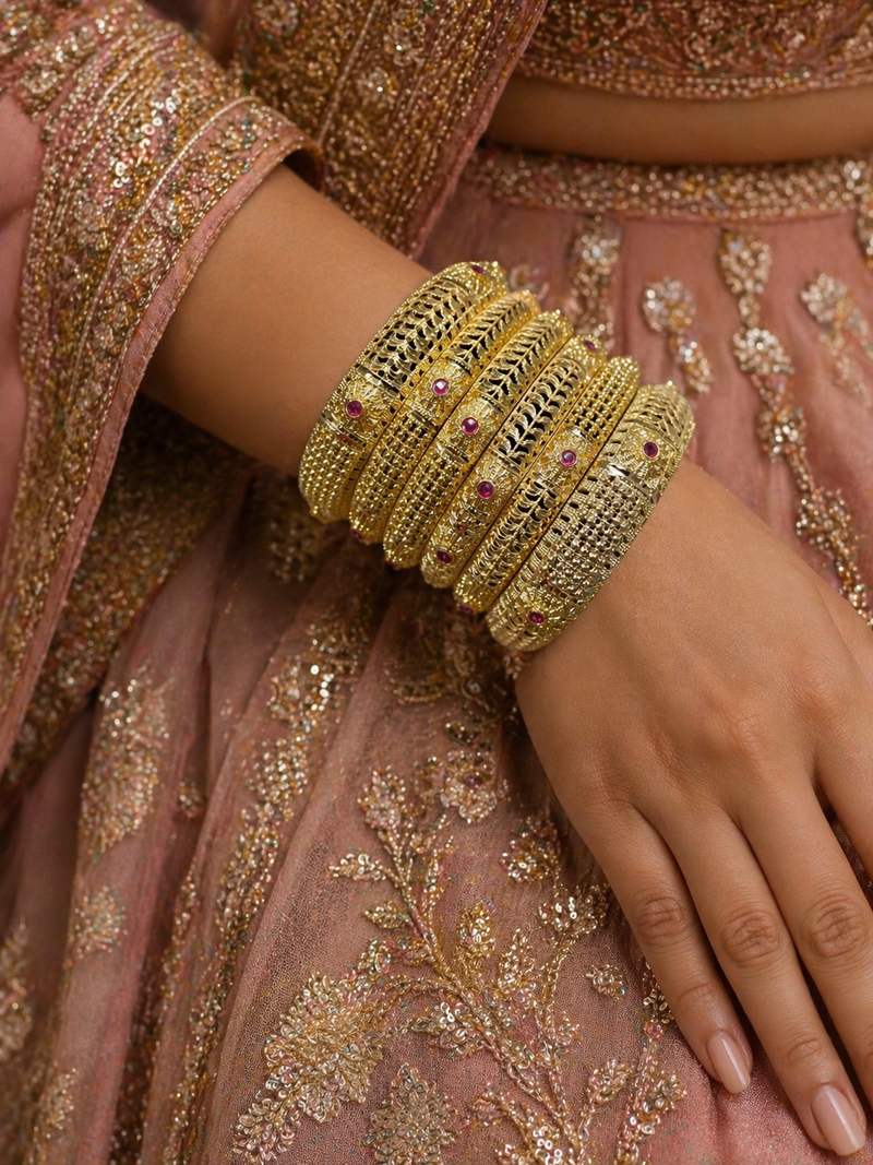 Banarasi Ruby Filigree Kada Set — set of 6 thick gold filigree kada bangles with intricate cut-work and ruby pink stone accents