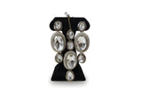 Close up of all white polki kundan long drop earrings with CZ halo and green enamel border - Jewellery by Aman