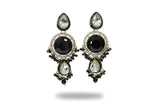 Close up of jet black kundan long drop earrings and tikka with green enamel and CZ halo