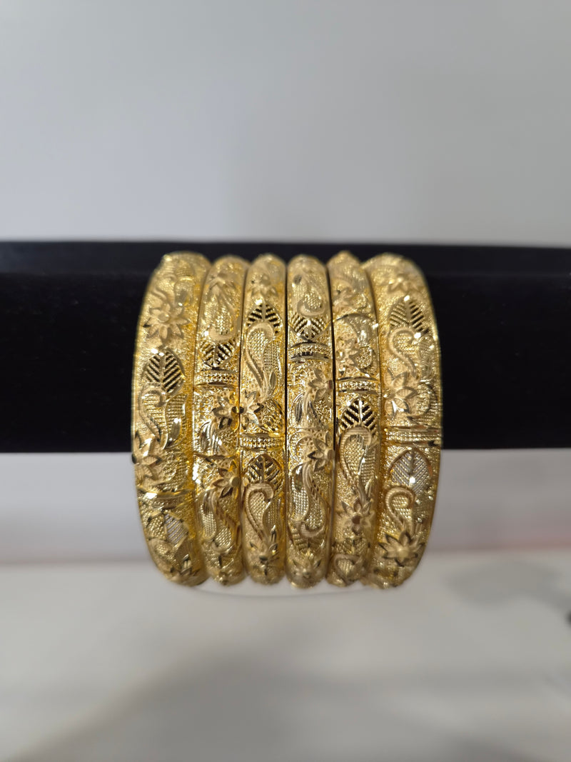 Nakshi Paisley Engraved Kada Set — set of 6 gold kada bangles with hand-engraved floral and paisley motifs and diamond-cut detailing