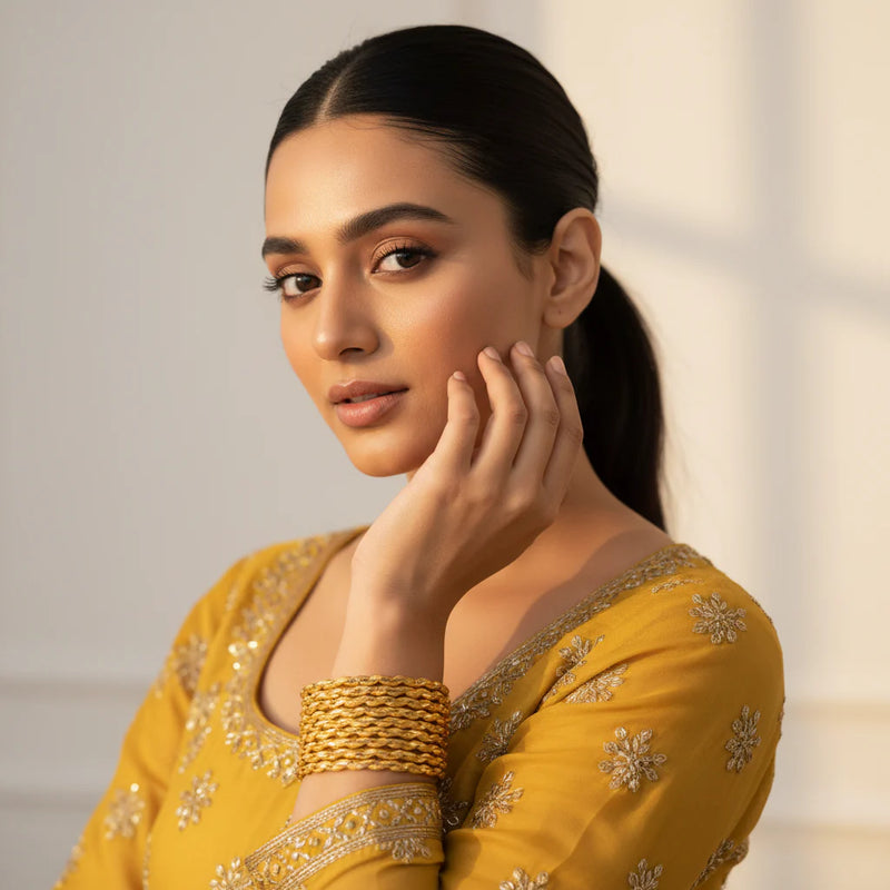 Gold Plated Twisted Bangles set of 8 worn by model - Jewellery by Aman