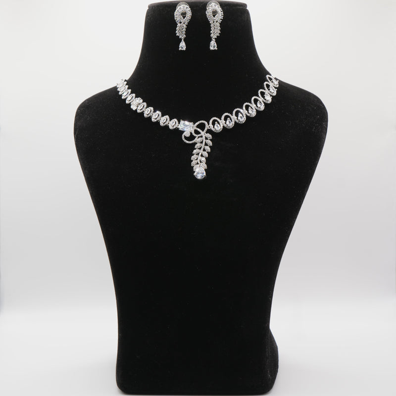 Jewelry set including a necklace and earrings on a black mannequin bust against a white background.