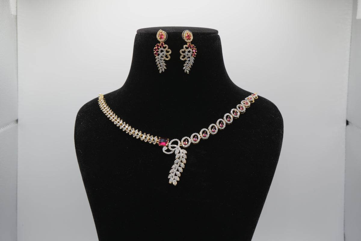 Ruby Red Jewelry set with necklace and earrings on a black mannequin bust against a white background