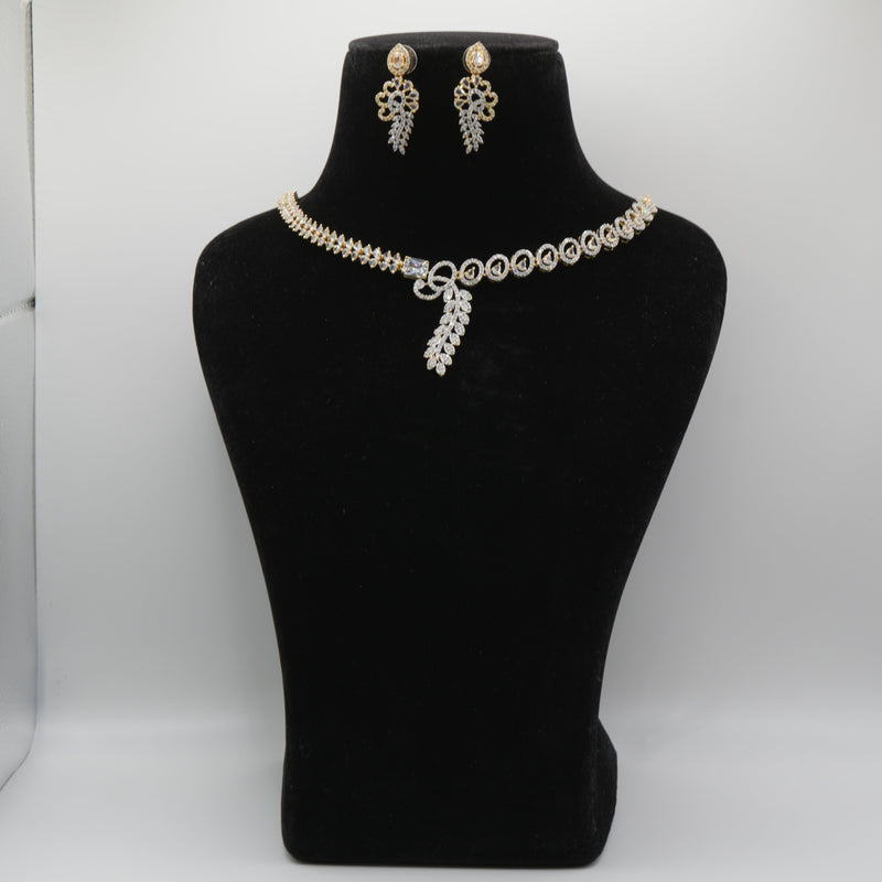 Pearl necklace and earrings set on a black mannequin bust against a white background