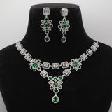 Close up of Panna Emerald Regal Pendant - VVS American Diamond Collection - Jewellery by Aman on a black velvet bust