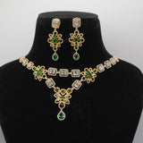 Close up of Emerald Green Jewelry set with necklace and earrings on a black mannequin bust against a white background