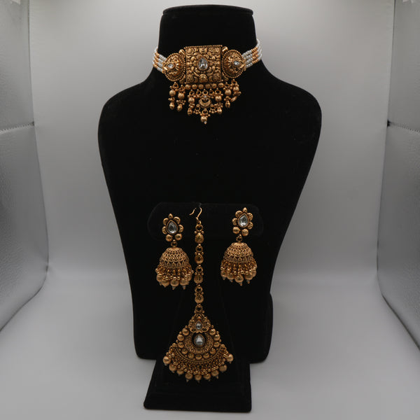 Ananya Kundan Centrepiece Choker Set — gold plated centrepiece pendant choker with clear kundan stones, pearl strand sides and gold bead drops, matching jhumka earrings and large teardrop maang tikka