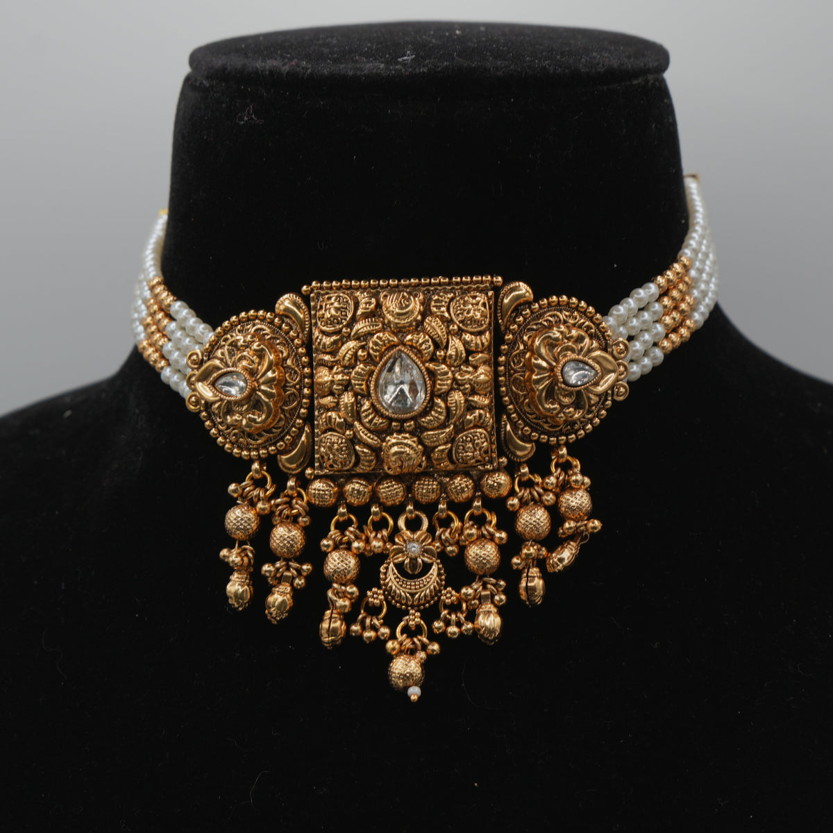 Ananya Kundan Centrepiece Choker Set — gold plated centrepiece pendant choker with clear kundan stones, pearl strand sides and gold bead drops, matching jhumka earrings and large teardrop maang tikka