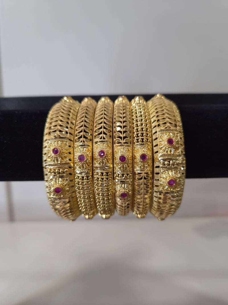 Banarasi Ruby Filigree Kada Set — set of 6 thick gold filigree kada bangles with intricate cut-work and ruby pink stone accents