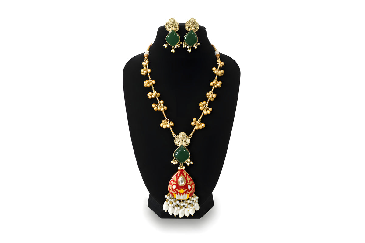 Kashmiri Red Meenakari Long Necklace Set with green earrings on display