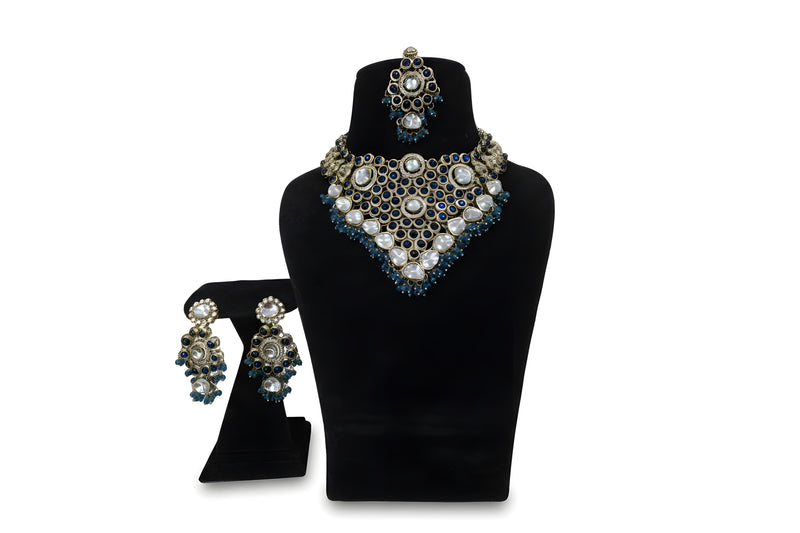 Blue Polki Kundan Choker Necklace Earrings and Tikka Set on display