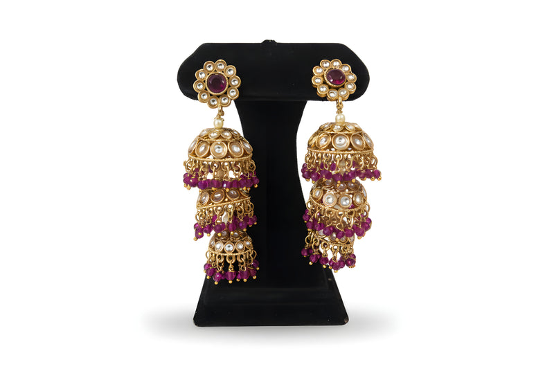 Dark Purple Triple Tier Kundan Jhumka Earrings with magenta crystal drops