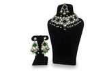 Emerald green kundan polki earrings close up with square mirror centre CZ halo and green bead pearl fringe