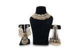 Blush pink polki wedding set full view showing choker necklace chandbali earrings tikka and passa on black velvet display