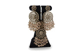 Blush pink polki chandbali earrings and maang tikka close up with circular disc polki motif and crystal bead cascade