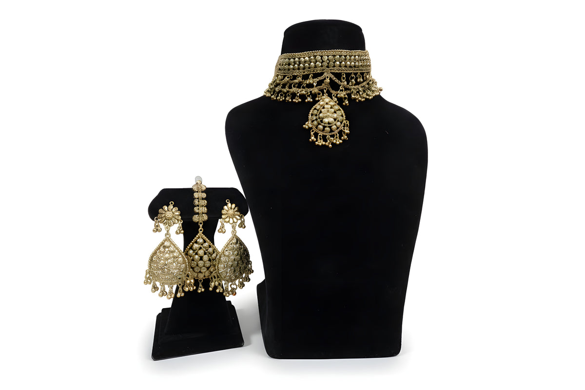 Gold plated floral rosette choker necklace set with matching earrings and tikka displayed on black velvet stand and bust full view