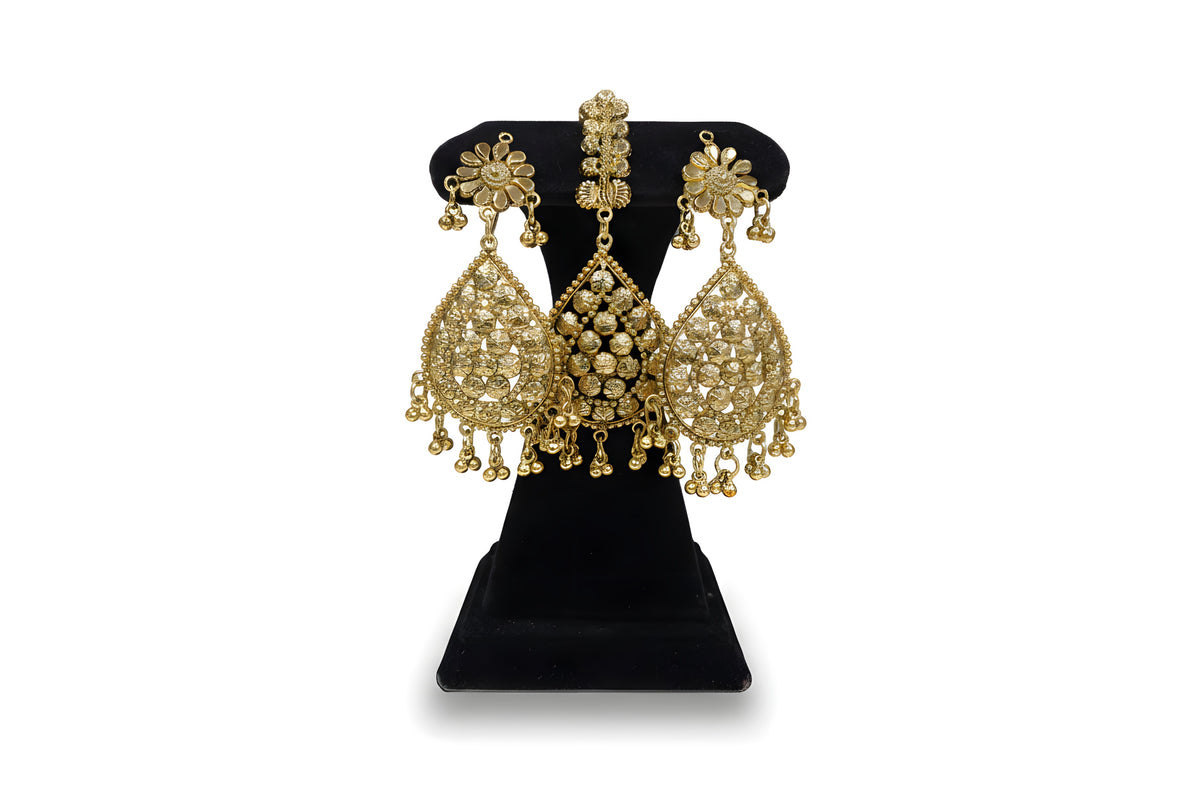 Gold plated floral rosette teardrop earrings and tikka close up with ghungroo drops on black velvet stand
