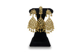 Gold plated floral rosette teardrop earrings and tikka close up with ghungroo drops on black velvet stand