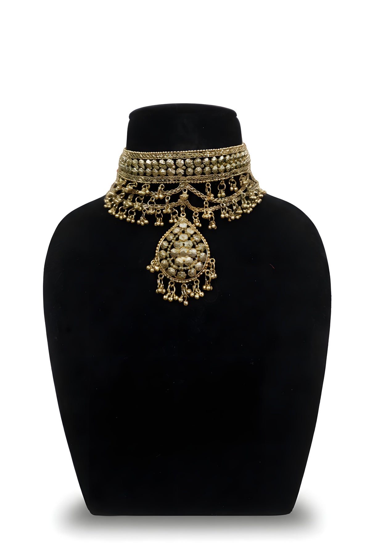 Gold plated floral rosette choker necklace close up with ghungroo chain swag and teardrop pendant on black velvet bust