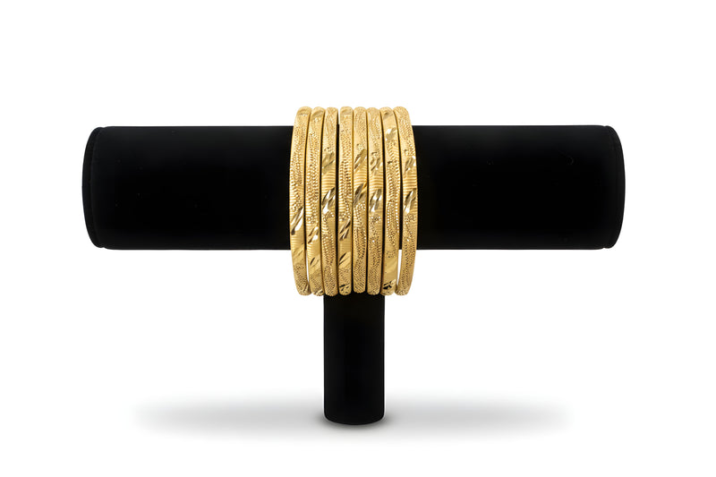 Gold plated diamond cut textured bangles set of 8 front view on black velvet stand showing full sparkle detail