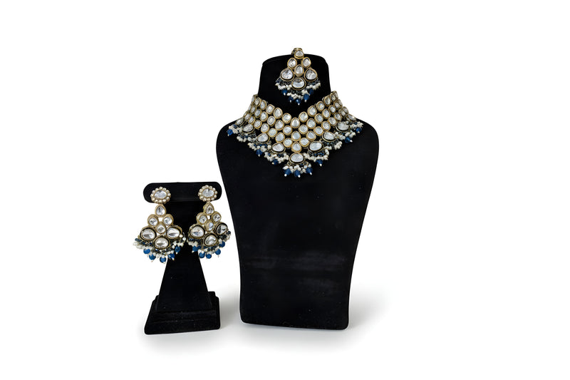 Gold polki kundan choker necklace set with blue crystal and pearl drops and matching earrings tikka full set