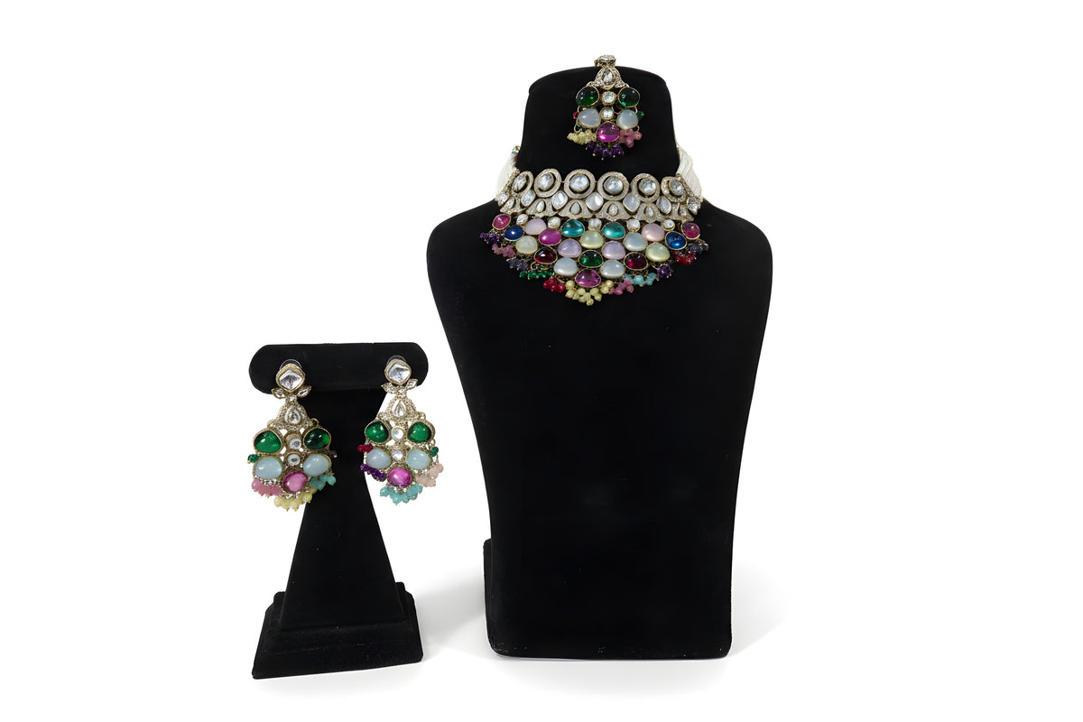 Multicolour polki kundan wedding choker necklace set with chandbali earrings and maang tikka on black display stand