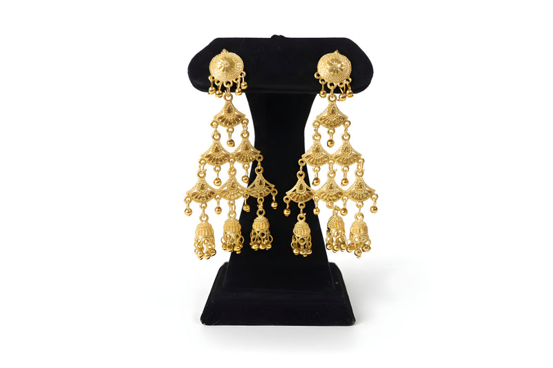 Gold plated three tier filigree chandelier earrings with triple jhumka bells on black display stand - Jewellery by Aman