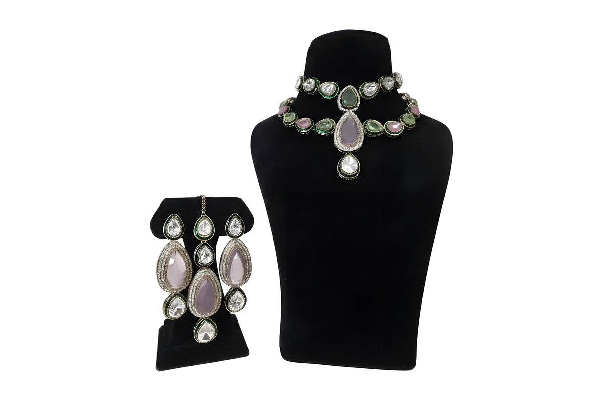 Pink and white polki kundan wedding choker necklace set with long earrings on black display stand