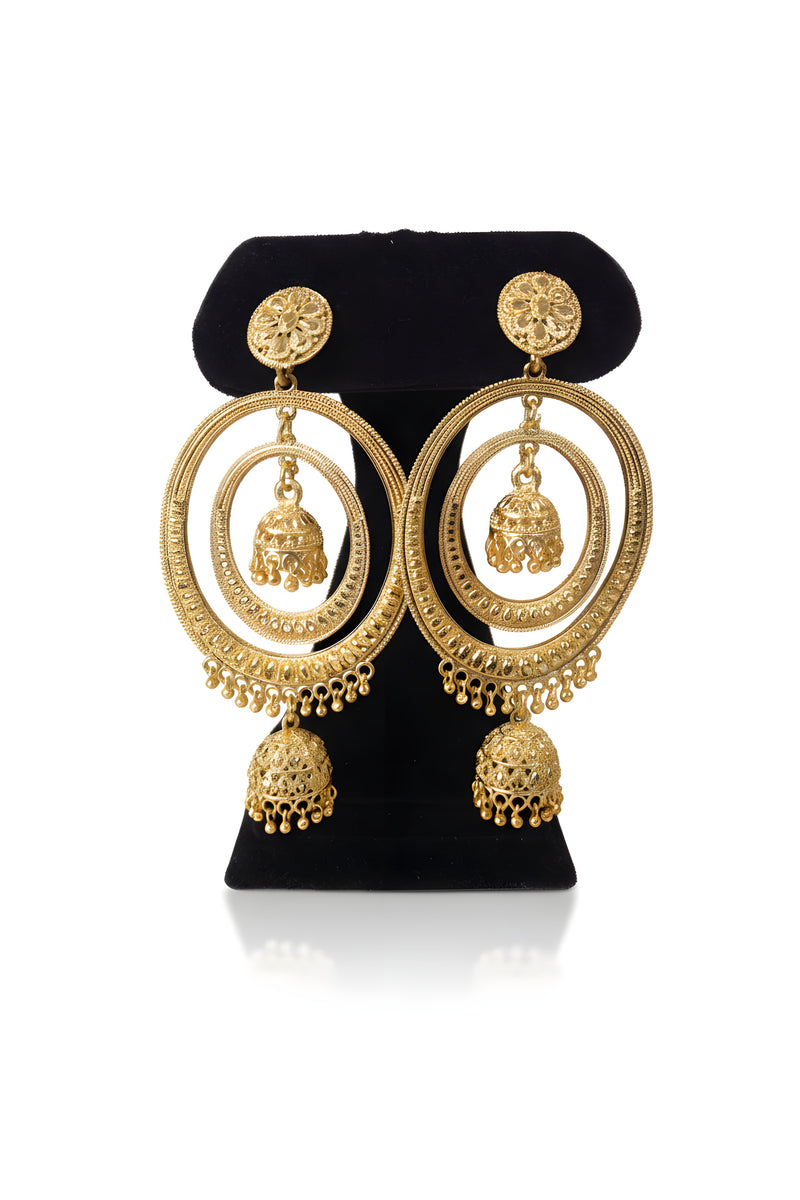 Gold plated oversized oval hoop earrings with suspended mini jhumka inside and large jhumka bell drop on black stand