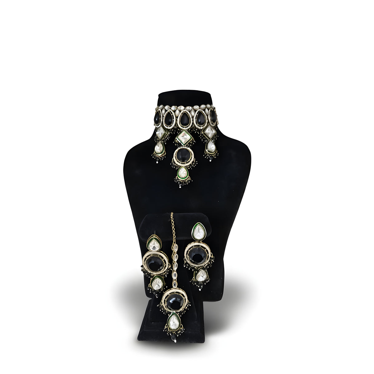Jet black kundan wedding choker necklace set with long earrings on black display stand