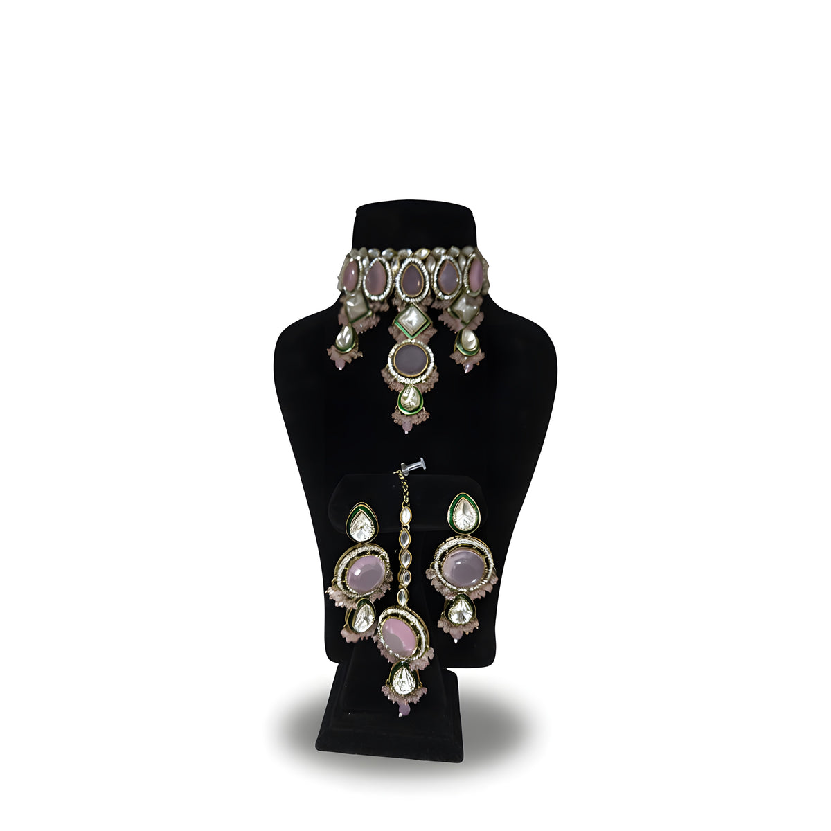 Blush pink kundan wedding choker necklace set with long earrings on black display stand