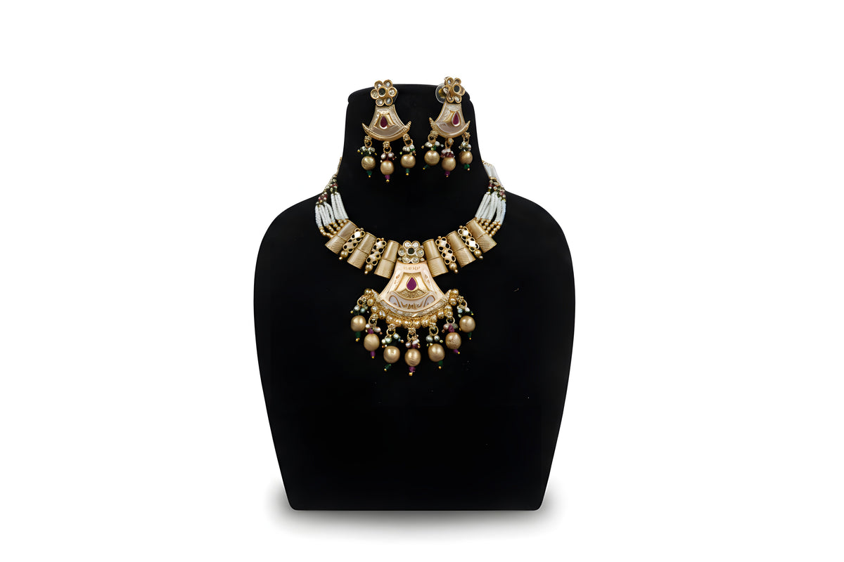 Antique gold meenakari fan pendant pearl necklace set with earrings and gold ball drops on black display stand