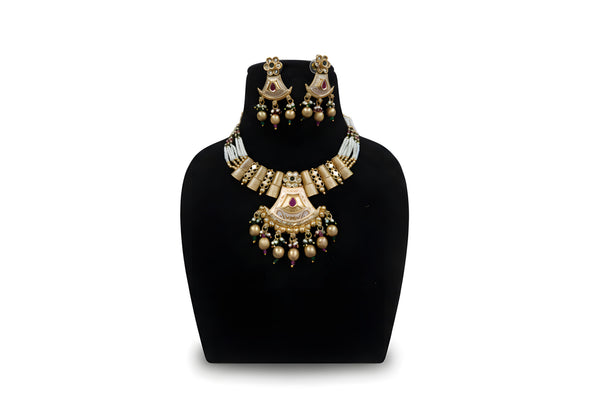 Antique gold meenakari fan pendant pearl necklace set with earrings and gold ball drops on black display stand