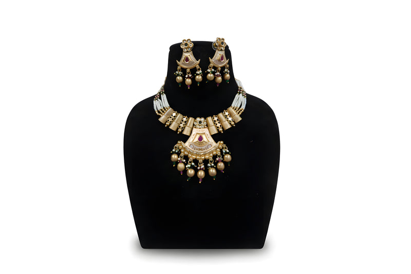 Antique gold meenakari fan pendant pearl necklace set with earrings and gold ball drops on black display stand