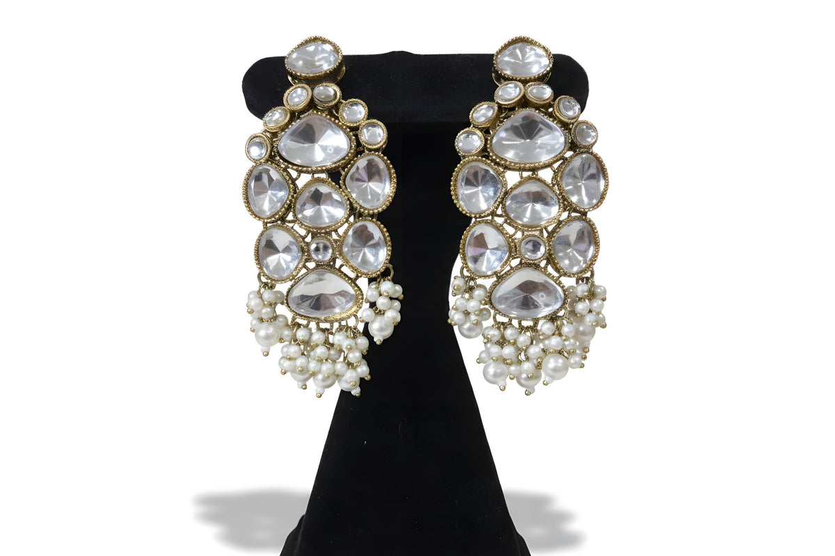 Close up of large polki kundan drop earrings with seed pearl fringe - pearl variant