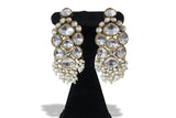 Close up of large polki kundan drop earrings with seed pearl fringe - pearl variant