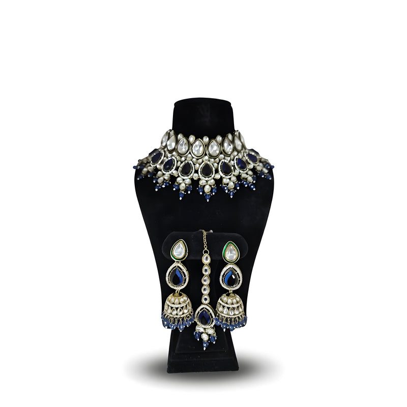 Royal blue kundan wedding choker necklace set with jhumka earrings and tikka on black display stand