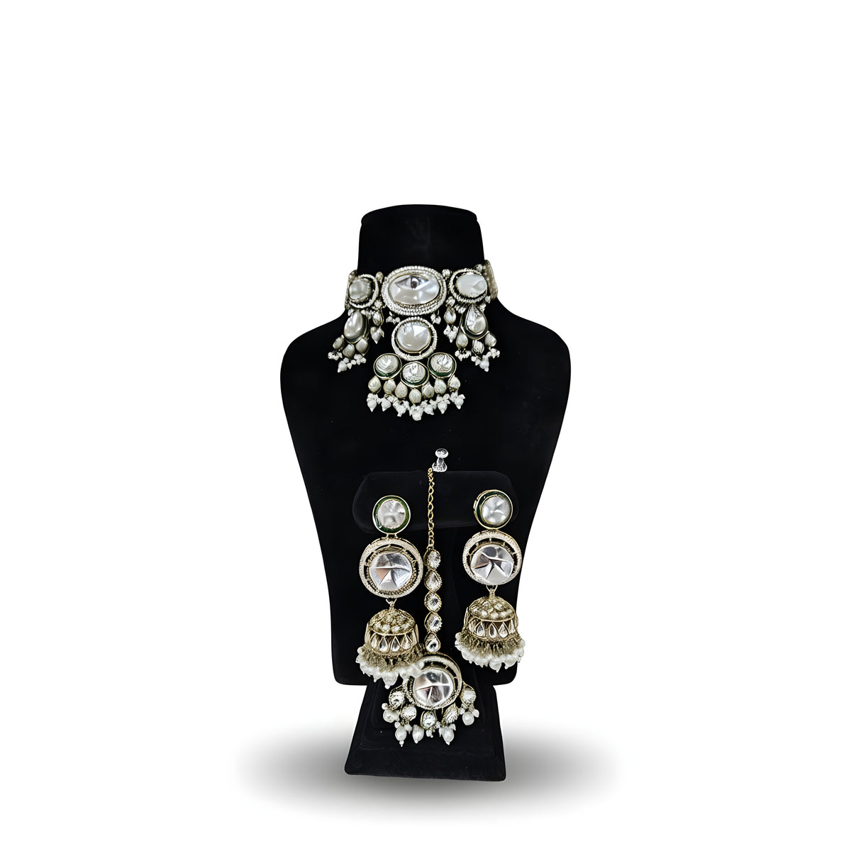 Polki kundan wedding choker necklace set with four tier jhumka earrings tikka and pearl drops on black display stand