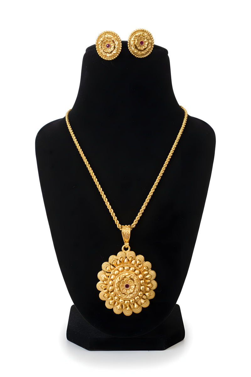 Gold plated mandala pendant necklace with twisted rope chain and matching round floral stud earrings on black display