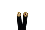 Close up of gold plated lotus petal stud earrings with ruby cabochon centre and beaded border - Jewellery by Aman
