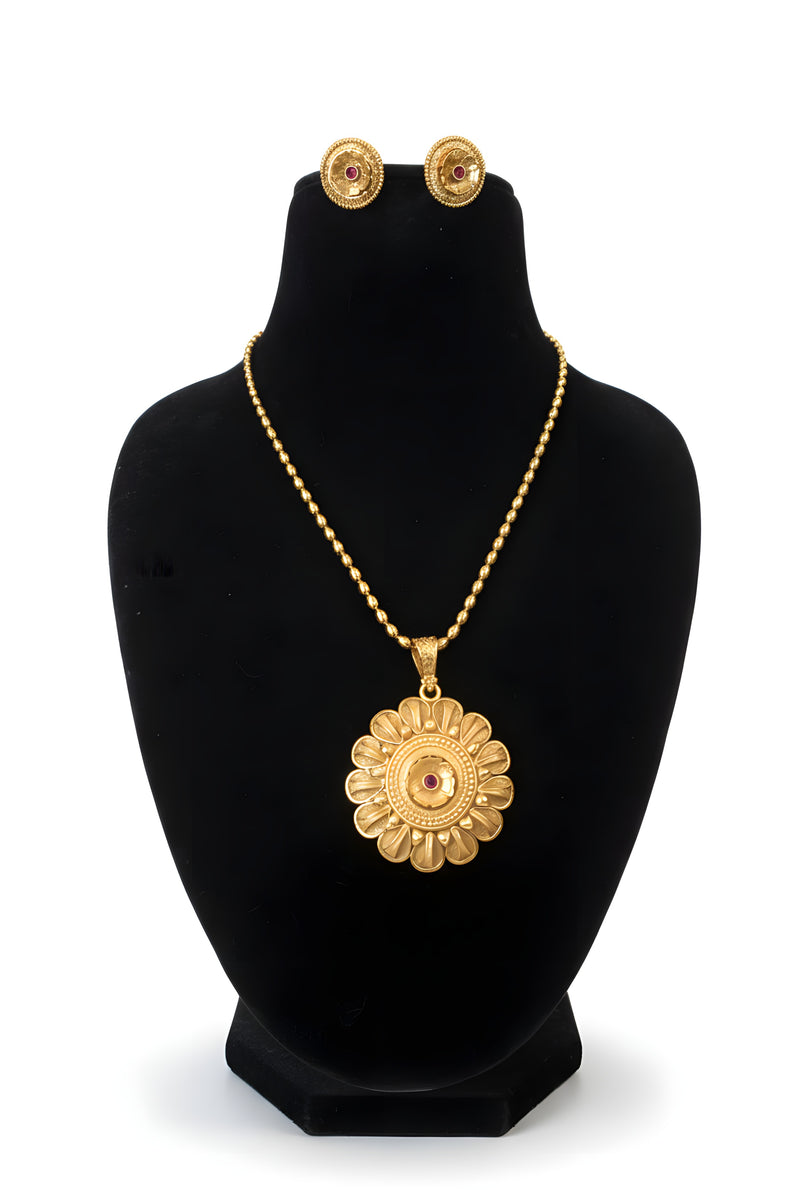 Gold plated sunflower pendant necklace with ball chain and matching round flower stud earrings on black display