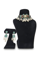 Zamurd Emerald Kundan Pearl Choker Set - Jewellery set on display stand