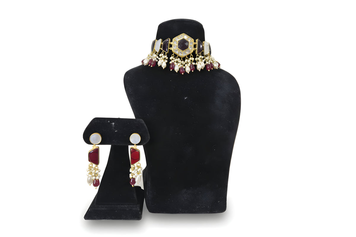 Yakoot Ruby Wine Kundan Pearl Choker Set - Jewellery set on display stand