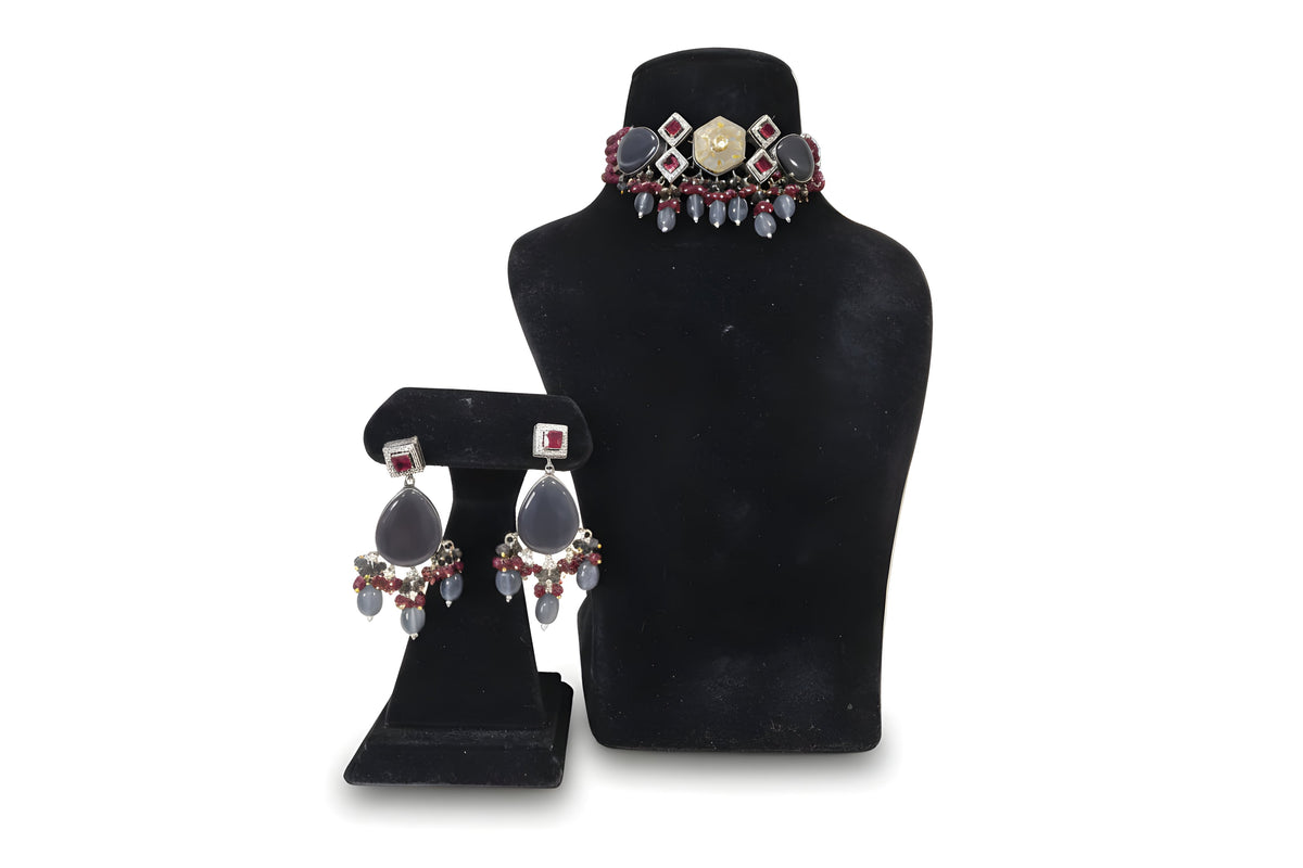 Dhuaan Smoky Grey Ruby Kundan Choker Set - Jewellery set on display stand