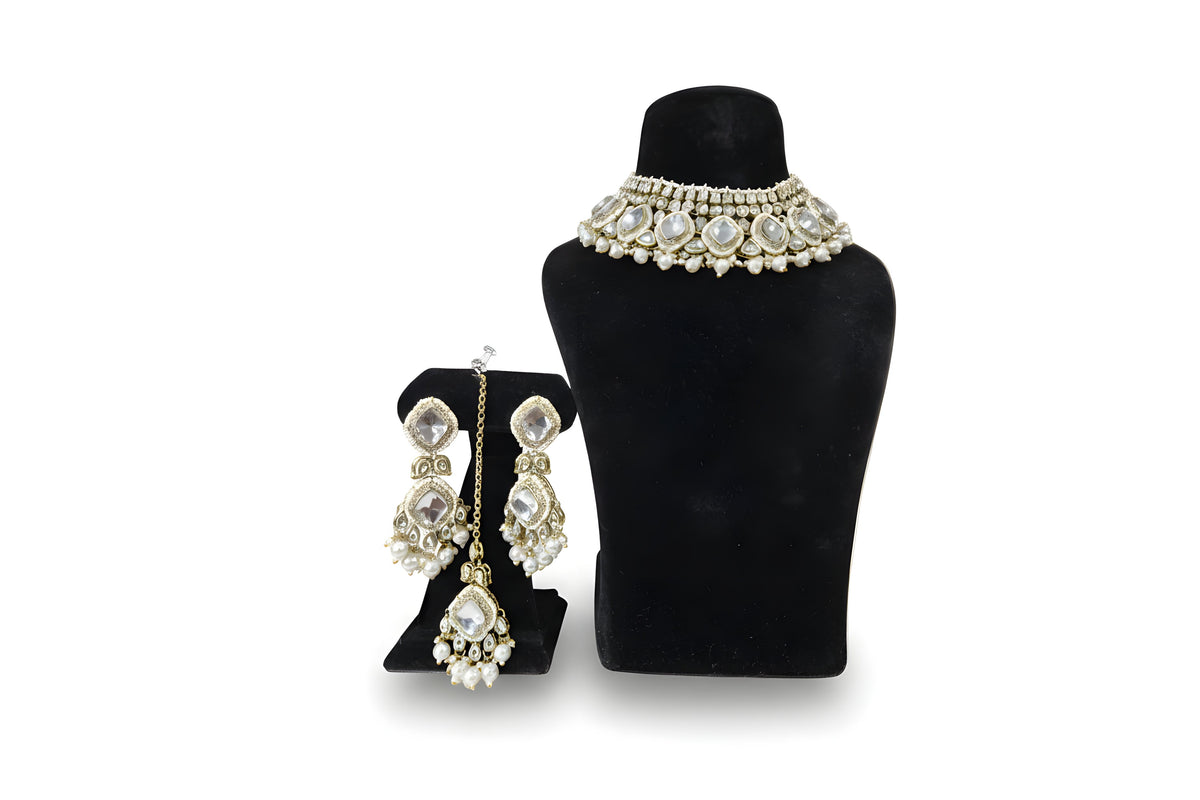 Chandni Clear Kundan Pearl Choker Set - Jewellery set on display stand