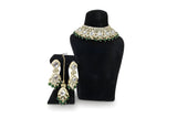 Chandni Emerald Kundan Choker Set - Jewellery set on display stand
